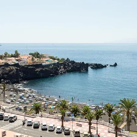Seguro El Sol En Playa De La Arena 푸에르토 데 산티아고